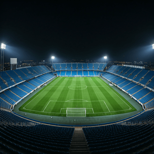 Aerial view of a packed football stadium during a night match